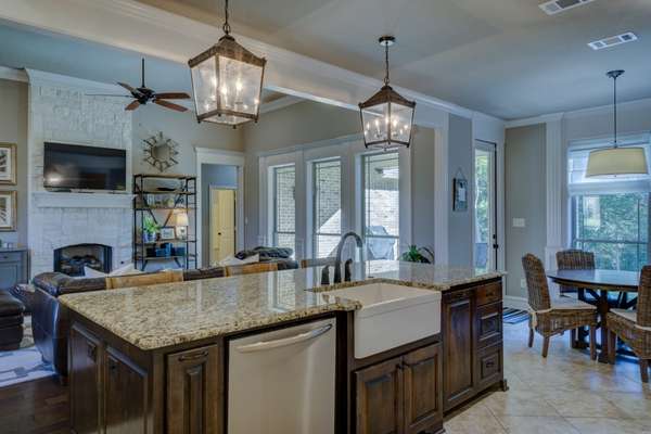 Add light fixtures To Lighten Dark Kitchen Cabinets